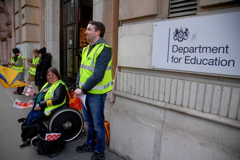 Members of the Public and Commercial Services Union outside the Department for Education in London. Reuters