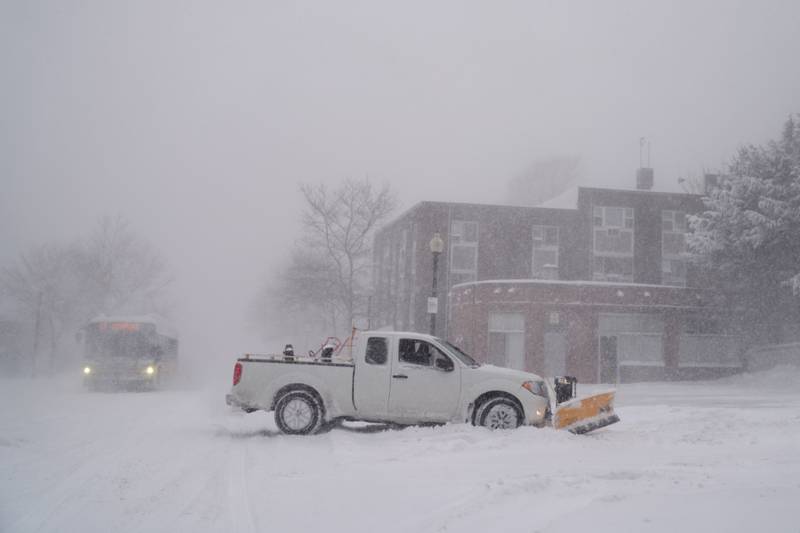 A snow plough clears snow during a blizzard in Boston, Massachusetts. Bloomberg