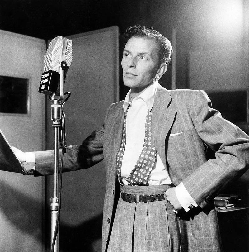 UNITED STATES - OCTOBER 01:  Photo of Frank SINATRA; posed, next to microphone, recording at Columbia Recording studios, Liederkrantz Hall  (Photo by William Gottlieb/Redferns/Getty Images)