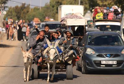Palestinians head south with their belongings after being ordered by Israel to leave northern Gaza on Friday. AFP 