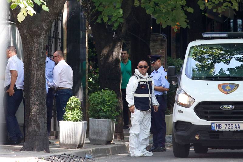 Police officers and forensics officials gather outside the Iranian embassy. AFP