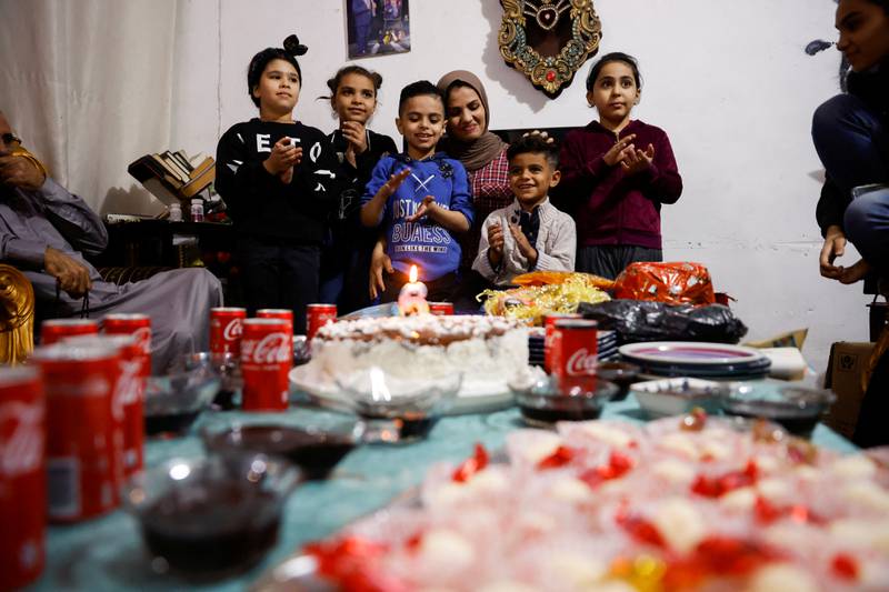 Carpenter Noor Al Janabi celebrates her son's birthday at her home in Baghdad.