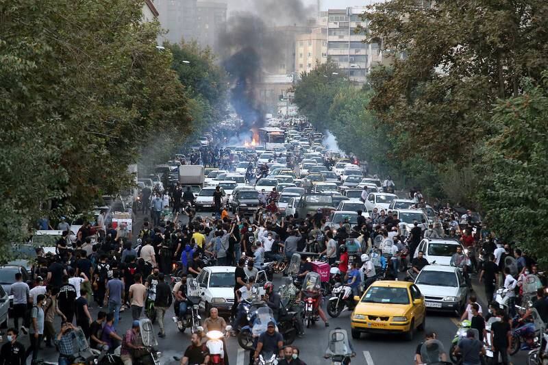 People clash with police during a protest following the death of Mahsa Amini in Tehran, Iran. EPA