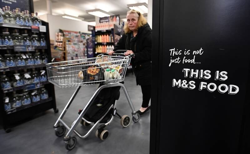 A customer at a Marks and Spencer store in London. EPA