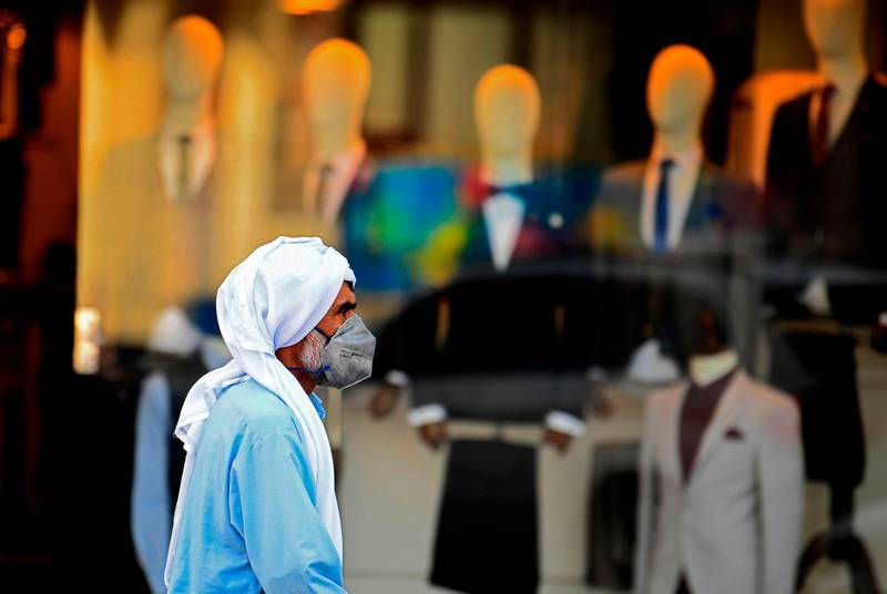 A man walks past a clothing shop in Dubai. AFP