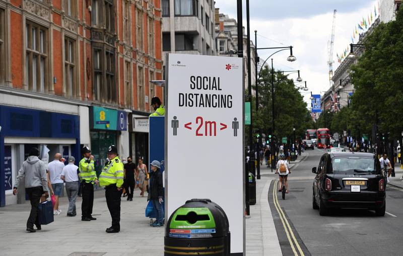 A view of a large sign reminding of two meters social distancing on Oxford Street in London, Britain, 15 June 2020.  EPA