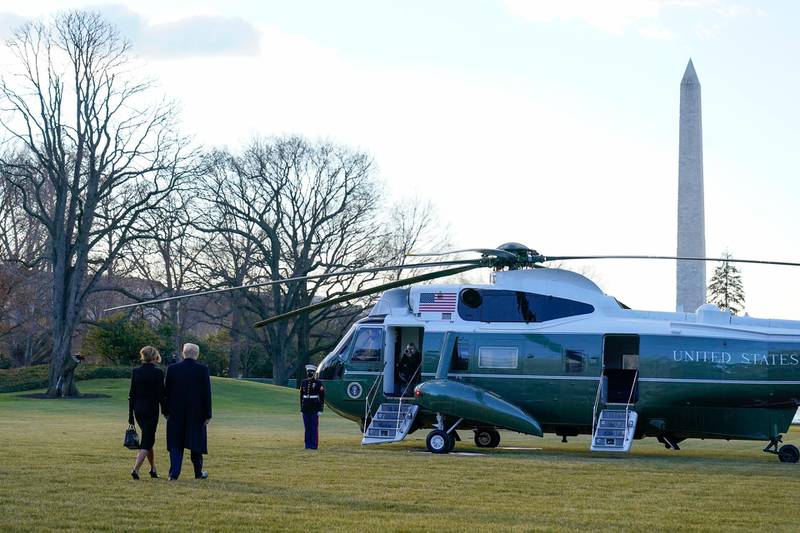 President Donald Trump and first lady Melania Trump walk to board Marine One on the South Lawn of the White House. AP Photo