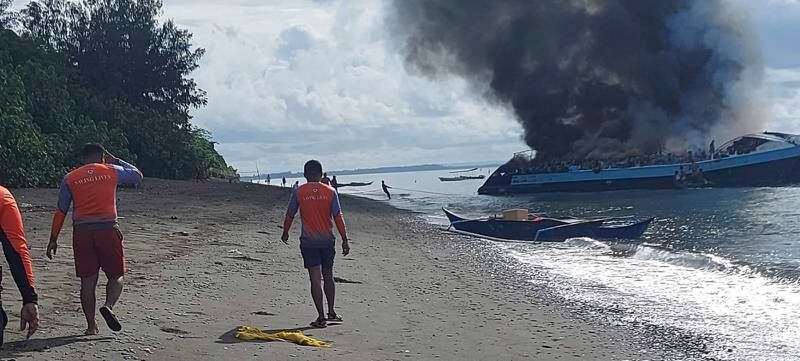 A handout photo made available by the Philippine Coast Guard (PCG) shows the wreckage of the passenger boat MV Mercraft 2 hauled to shore following a fire in waters off Quezon province, Philippines 23 May 2022.  Data from the PCG shows that seven people were killed and 120 were rescued after the passenger boat caught fire while travelling from Polillo to Real in Quezon province.  Authorities continue to determine the cause of the blaze.   EPA / PHILIPPINE COAST GUARD  /  HANDOUT BEST QUALITY AVAILABLE HANDOUT EDITORIAL USE ONLY / NO SALES
