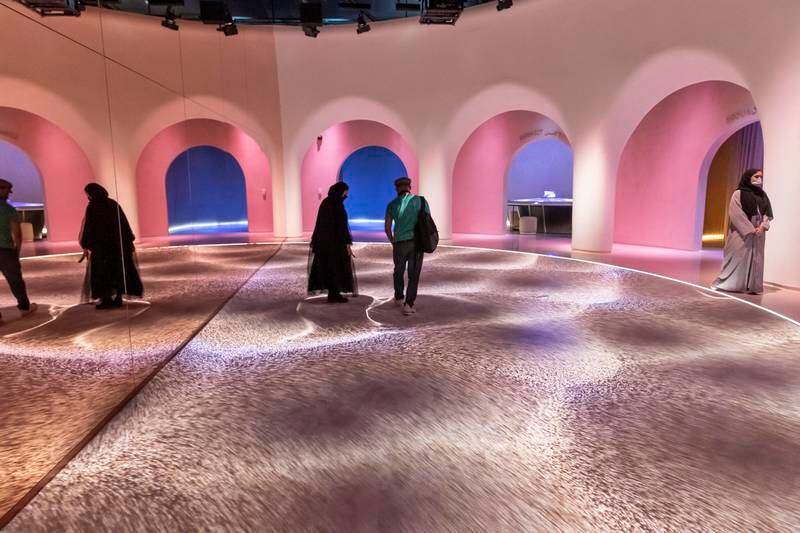 Experiencing the sand bath at Museum of the Future. Antonie Robertson / The National