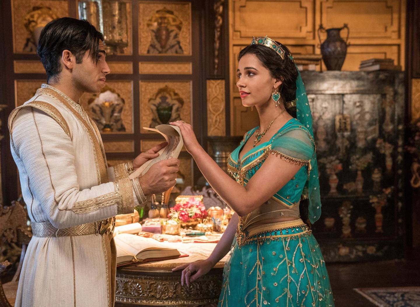 This image released by Disney shows Mena Massoud as Aladdin, left, and Naomi Scott as Jasmine in Disney's live-action adaptation of the 1992 animated classic "Aladdin." (Daniel Smith/Disney via AP)