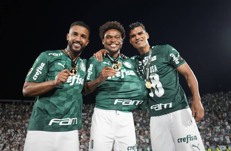 Palmeiras' Luiz Adriano, centre, celebrates winning the Copa Libertadores with teammates. Reuters