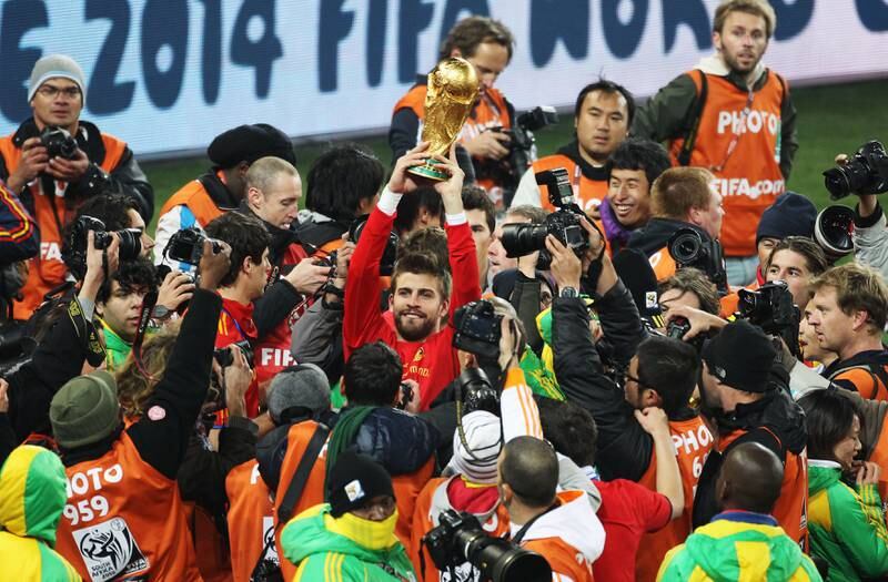 Gerard Pique of Spain holds the World Cup aloft after the 2010 final against Netherlands at Soccer City Stadium on July 11, 2010 in Johannesburg, South Africa. Spain won the match 1-0. Getty Images