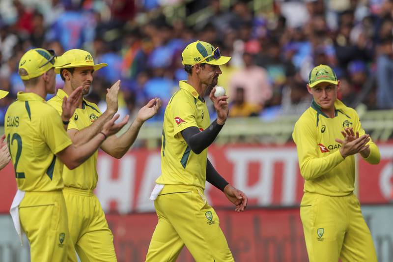 Australia's Mitchell Starc is applauded off the pitch by teammates after taking five wickets. AP
