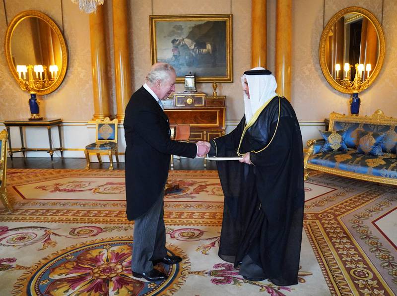 Meeting Kuwait's UK ambassador Bader Al Awadi at Buckingham Palace. AFP