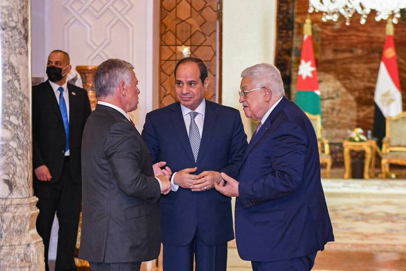 Jordan's King Abdullah II speaking with Egypt's President Abdel Fattah El Sisi and Palestinian President Mahmoud Abbas. AFP
