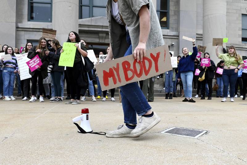 People demonstrate outside the Boone County Courthouse in Columbia, Missouri, in May. Missourian / AP
