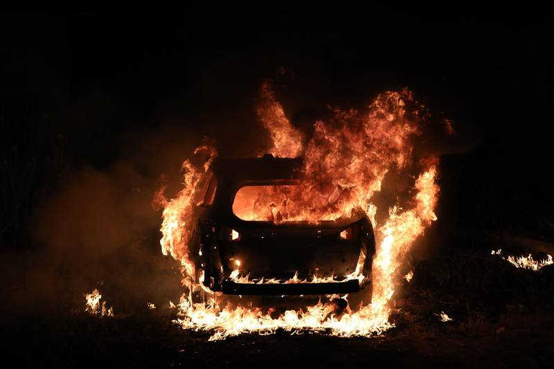 A car belonging to Israeli settlers goes up in flames during a protest in support of Palestinian families facing eviction in Sheikh Jarrah neighbourhood in East Jerusalem. EPA