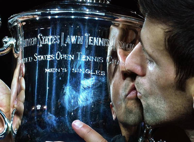 Serbia's Novak Djokovic kisses the trophy after winning against Argentina's Juan Martin del Potro during their Men's Singles Finals match at the 2018 US Open at the USTA Billie Jean King National Tennis Center in New York on September 9,2018. (Photo by TIMOTHY A. CLARY / AFP)