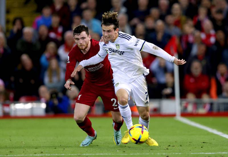 Liverpool's Andrew Robertson (left) and Leeds United's Brenden Aaronson battle for the ball during their match at Anfield. AP.