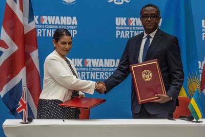 British Home Secretary Priti Patel and Rwandan Minister of Foreign Affairs and International Co-operation Vincent Biruta, in April 2022 after signing an agreement in Rwanda. AFP
