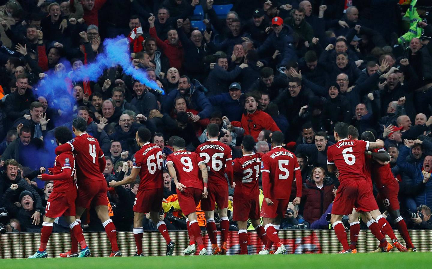 Soccer Football - Champions League Quarter Final Second Leg - Manchester City vs Liverpool - Etihad Stadium, Manchester, Britain - April 10, 2018   Liverpool's Mohamed Salah celebrates scoring their first goal with teammates   Action Images via Reuters/Jason Cairnduff