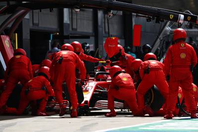 Charles Leclerc of Ferrari during a pitstop for new tyres. Getty