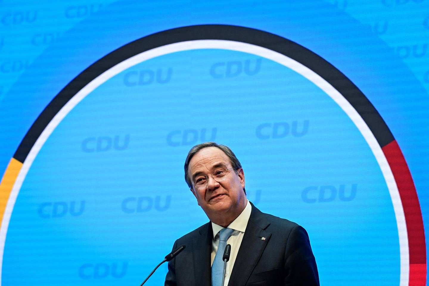 (FILES) In this file photo taken on April 20, 2021 North Rhine-Westphalia's State Premier and head of Germany's conservative Christian Democratic Union (CDU) party Armin Laschet gives a press conference at the headquaters of the conservative Christian Democratic Union (CDU) party in Berlin. A sea change in German politics began this week with two leading parties announcing their candidates to succeed Angela Merkel at September's elections, when the veteran chancellor will bow out from politics. After 16 years with Merkel at the helm of Europe's largest economy, politics in steady-as-it-goes Germany is entering a period of unpredictability. / AFP / POOL / Tobias SCHWARZ
