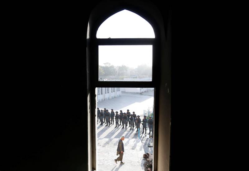 Afghan policemen inspect a Shi'ite Muslim mosque after yesterday's attack in Kabul, Afghanistan. Mohammad Ismail / Reuters