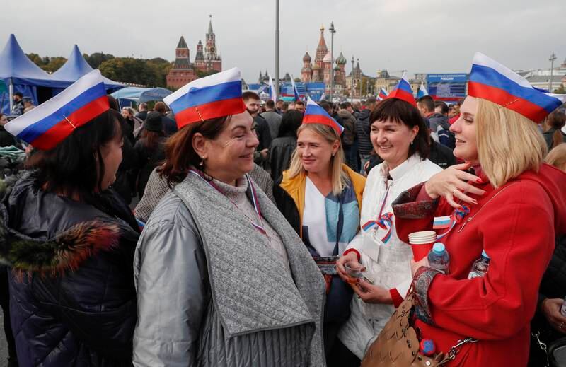 Russians gather for a celebration after the ceremony in central Moscow. EPA