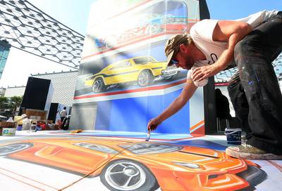 Artist Leon Keer, from the Netherlands, gives the final touch at the Dubai 3D Art Festival at the Dubai City Walk in Dubai. Satish Kumar / The National
