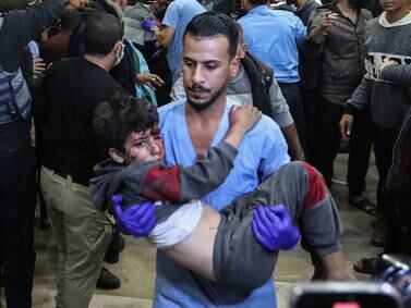 A medic carries an injured Palestinian at Nasser Medical Hospital as Khan Younis in Gaza continues to be bombarded. Getty Images