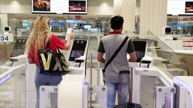 Passengers arrive at Dubai International Airport. Pawan Singh / The National