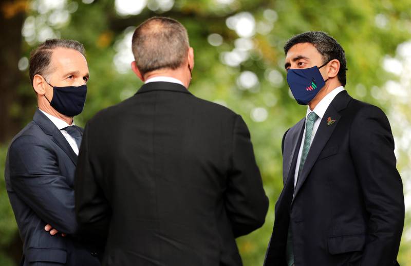 Sheikh Abdullah bin Zayed and his Israeli counterpart Gabi Ashkenazi welcome each other watched by German Foreign Minister Heiko Maas before their historic meeting at Villa Borsig in Berlin, Germany.  Reuters