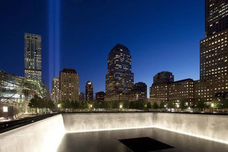 The Tribute in Light shines above a reflecting pool at the National September 11 Memorial on the 11th anniversary of the terrorist attacks of Sept. 11, 2001. Mark Lennihan / AP Photo