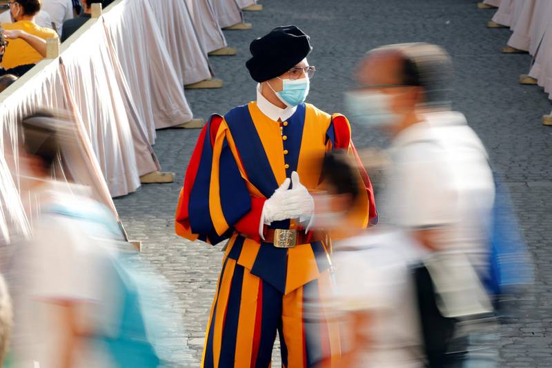A Swiss Guard patrols ahead of Pope Francis' weekly general audience at the San Damaso courtyard, at the Vatican. Reuters