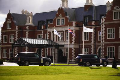 Government cars arrive at the Fairmont Windsor Park hotel. PA