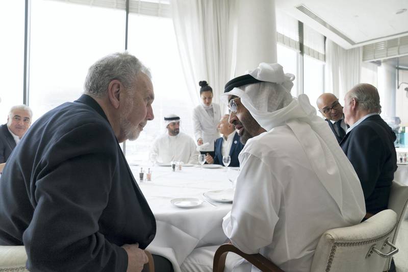 ABU DHABI, UNITED ARAB EMIRATES - November 24, 2018: HH Sheikh Mohamed bin Zayed Al Nahyan, Crown Prince of Abu Dhabi and Deputy Supreme Commander of the UAE Armed Forces (R), speaks with John Sexton, former President of New York University and CEO of The Catalyst (L), during the second day of the 2018 Formula 1 Etihad Airways Abu Dhabi Grand Prix, at Yas Marina Circuit. 

( Mohamed Al Hammadi / Ministry of Presidential Affairs )
---