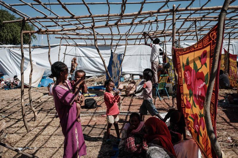 Newly arrived Ethiopian refugees who fled Ethiopia's Tigray conflict rest at Um Raquba refugee camp in Gedaref, eastern Sudan. AFP