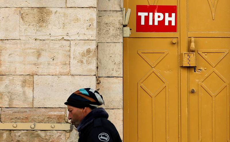 A sign of the Temporary International Presence in Hebron (TIPH) is seen on its office in Hebron, in the Israeli-occupied West Bank January 29, 2019. REUTERS/Mussa Qawasma