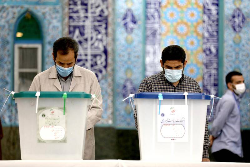 Iranian election officials prepare ballot boxes at a polling station in Tehran. AP Photo