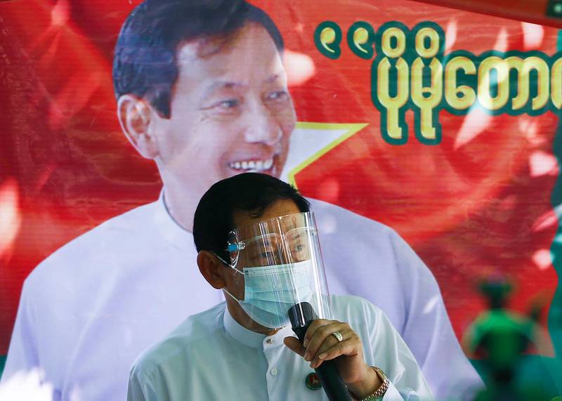 Than Htay, chairman of the military-aligned opposition Union Solidarity and Development Party (USDP), wears a face shield and a mask speaks during a campaign in Naypyidaw, Myanmar, for the November 8 national elections. AFP