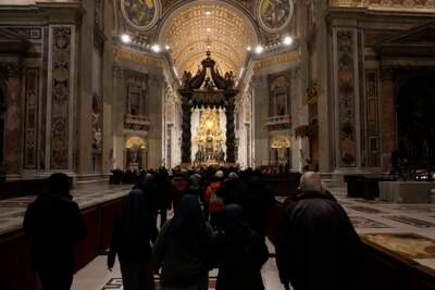 Mourners enter St Peter's Basilica. AP