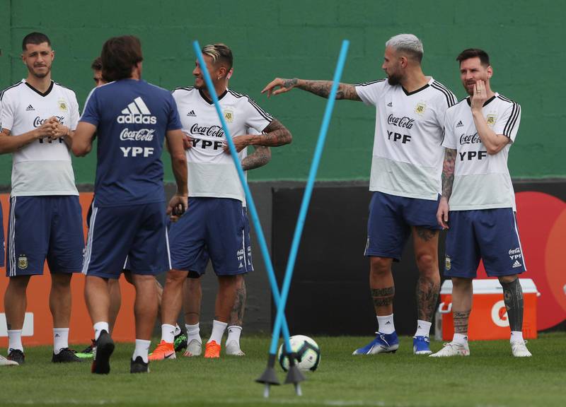 Messi and teammates work on tactics during training. Reuters