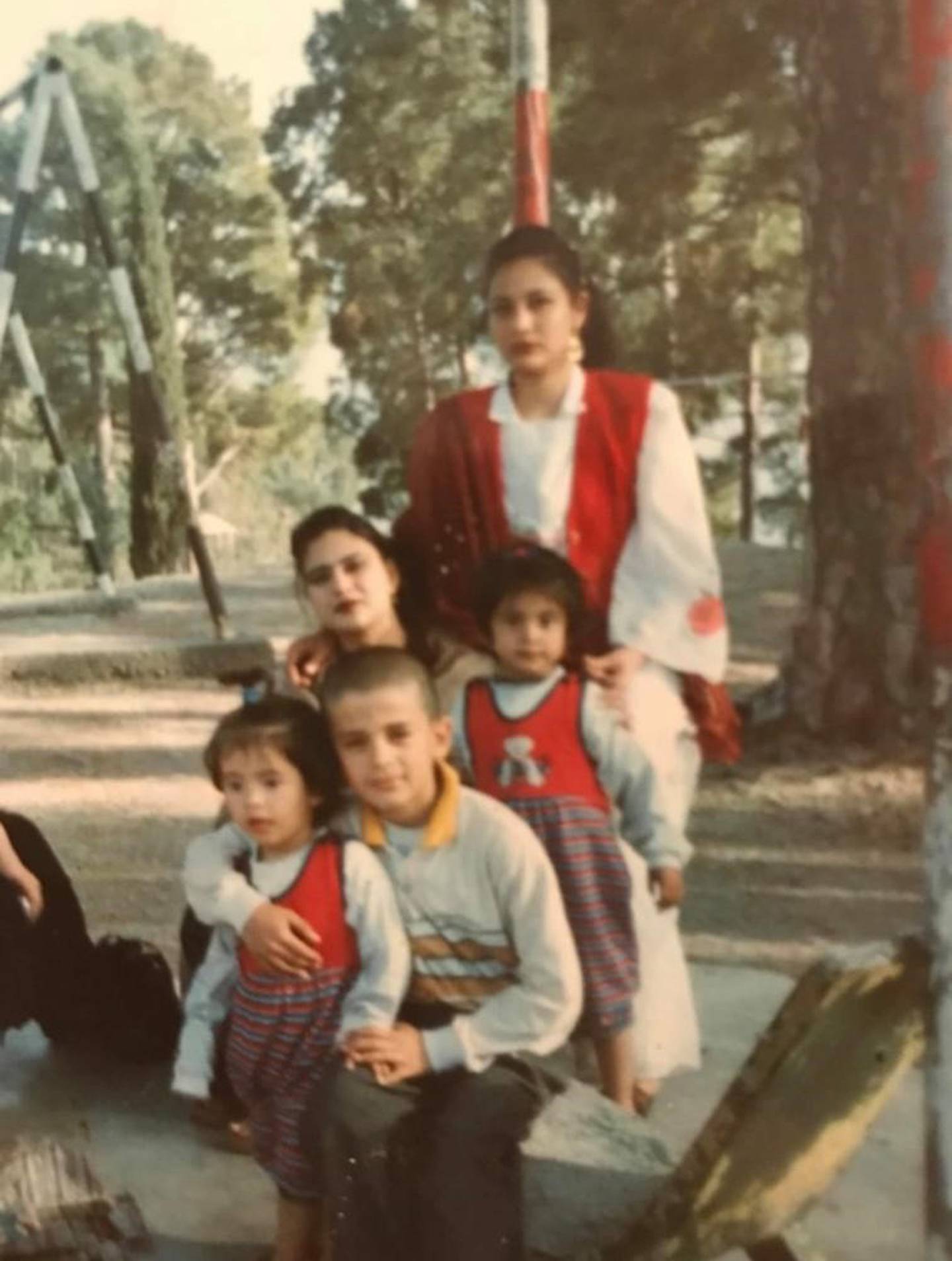 Lida Nasiri, on the right in the red bib, with her mother and family members in Turkmenistan, when Lida was 2 years old. Photo: Lida Nasiri