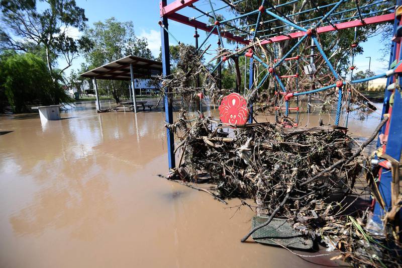 Play equipment is covered in debris and surrounded by flood water in Dalby, Queensland, Australia. EPA
