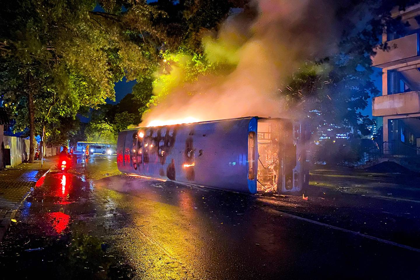 Dozens of buses used by Rajapaksa loyalists to travel to Colombo earlier in the day were torched or damaged. AFP