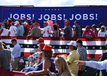 Supporters listen as US President Donald Trump delivers remarks on the economy in Wisconsin in August. The US added 661,000 jobs in September but the unemployment rate fell to 7.9 per cent, underscoring the economy's tortured recovery from Covid-19. AFP