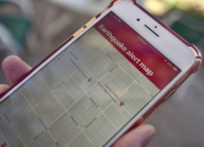 An earthquake warning application on a smartphone in Los Angeles. AP