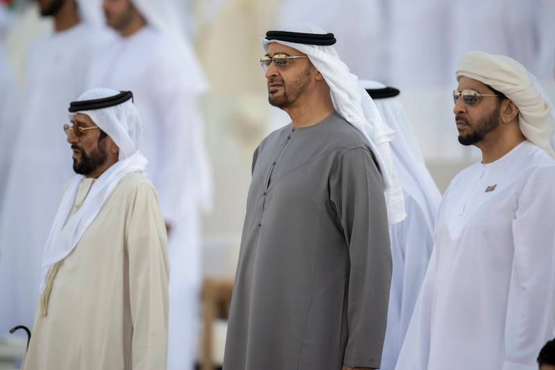 Sheikh Mohamed; Sheikh Tahnoon bin Mohamed, Ruler's Representative in Al Ain Region; and Sheikh Hamdan bin Zayed, Ruler’s Representative in Al Dhafra Region, stand for the national anthem. Rashed Al Mansoori /  Presidential Court