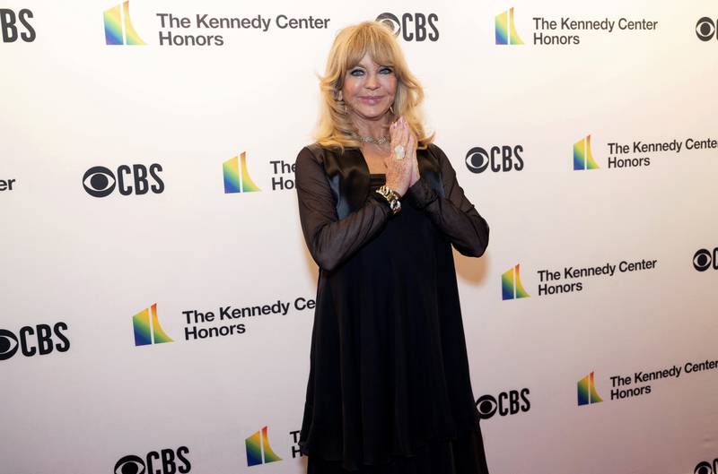 The actress Goldie Hawn clasps her hands as she is photographed. AP